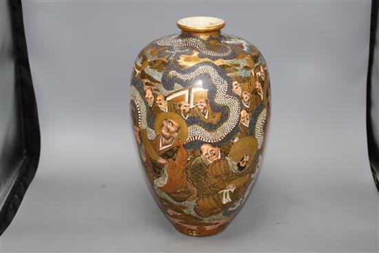 A Japanese Satsuma vase, decorated with a dragon and immortals, signed to the base, height 36cm